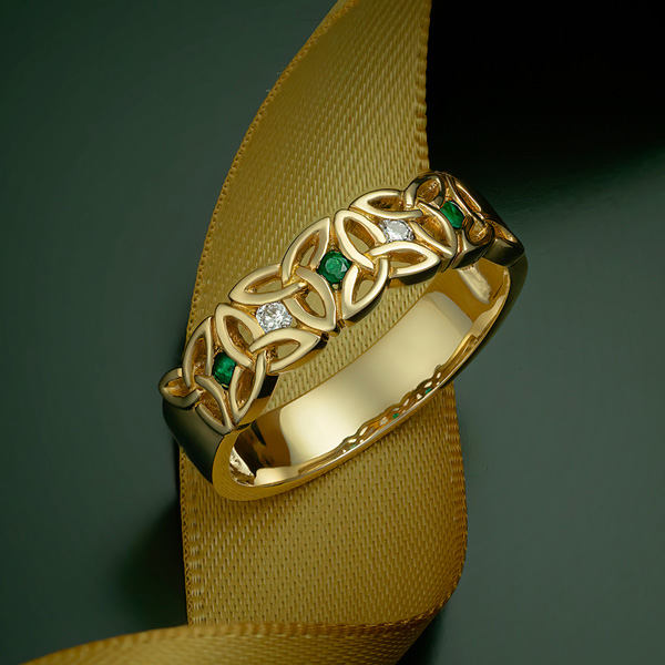 Diamond and emerald trinity knot ring